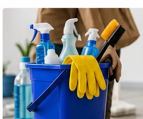 Bucket of professional cleaning supplies and gloves